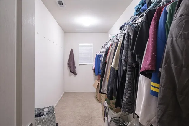 a view of a swimming pool with a patio and garden