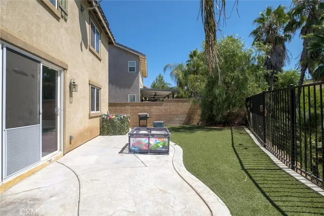 a front view of a house with a garden and yard