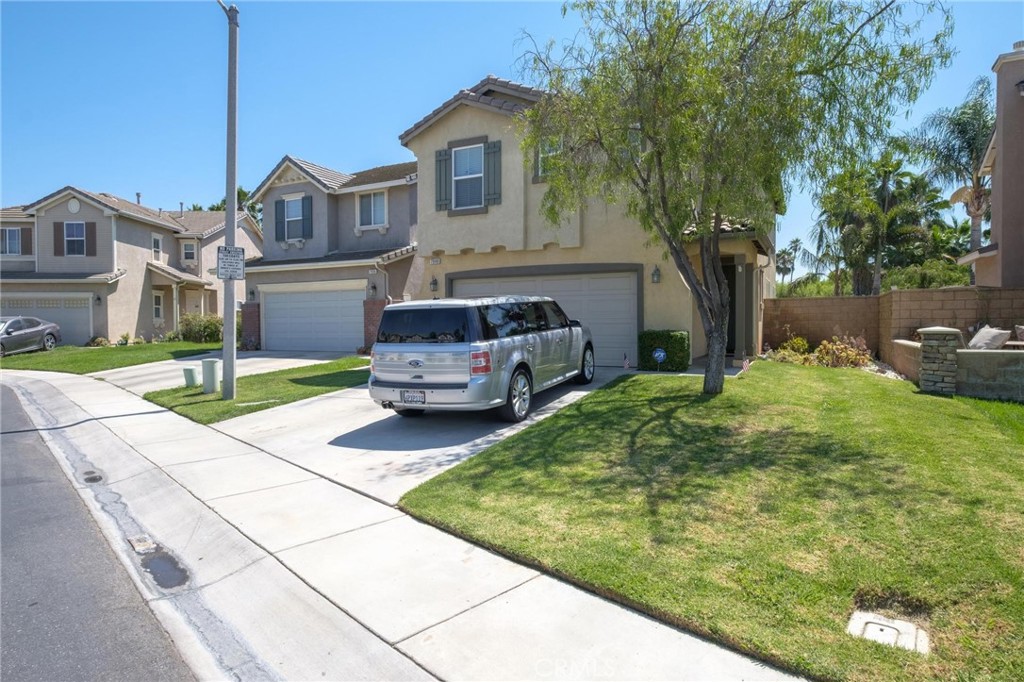 7940 Shadow Trails Lane Jurupa Valley, CA 92509 - Photo 33 of 34 a front view of a house with garden