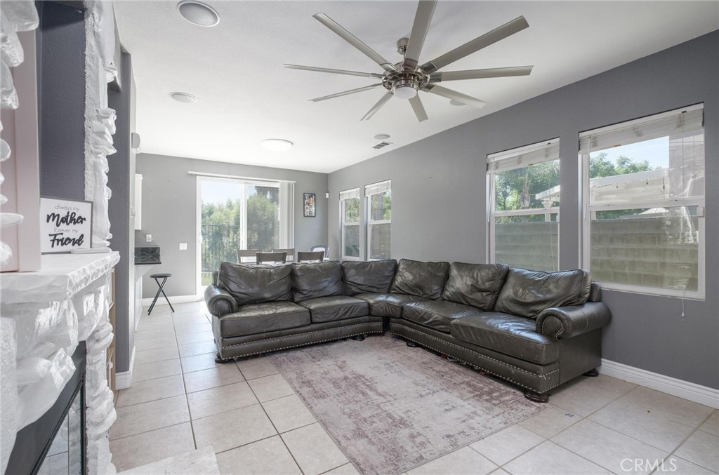 7940 Shadow Trails Lane Jurupa Valley, CA 92509 - Photo 5 of 34 a living room with furniture and a large window