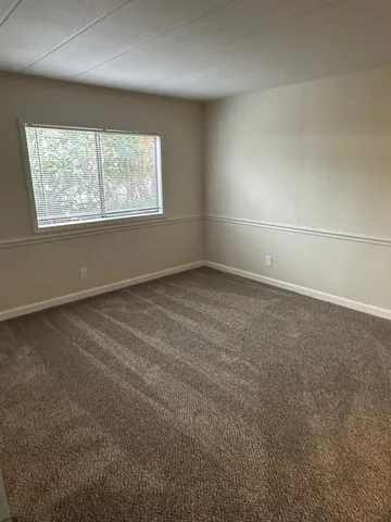 a view of a backyard of the house