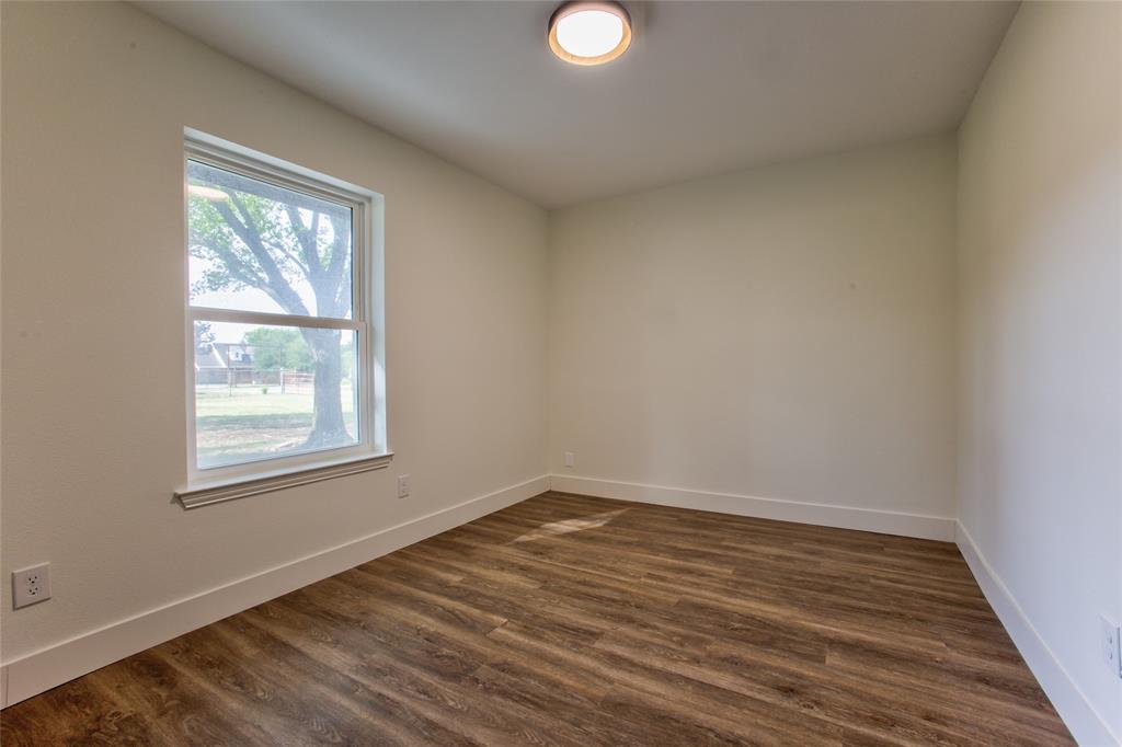 206 Americana Road Palmer, TX 75152 - Photo 27 of 40 View #1 Into #1 Bedroom Or Home Office wNew Recessed Light, LVP Flooring Thoughout