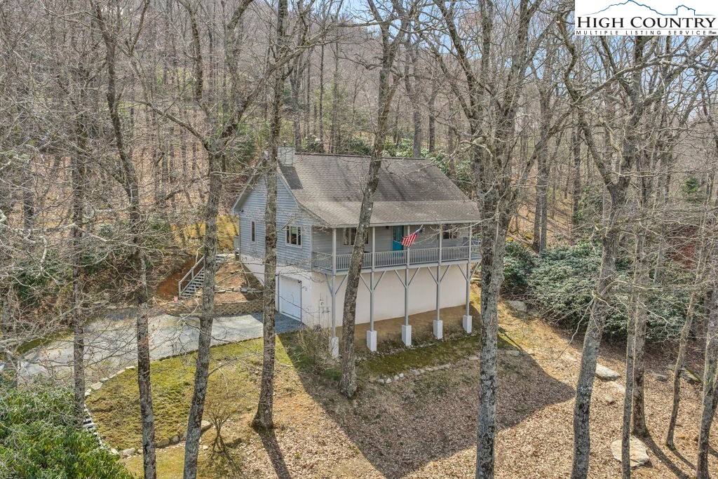 438 Virgil's Lane Boone, NC 28607 - Photo 1 of 32 a view of a house with a yard