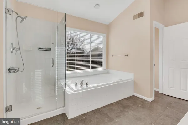 a bathroom with a sink double vanity and a mirror