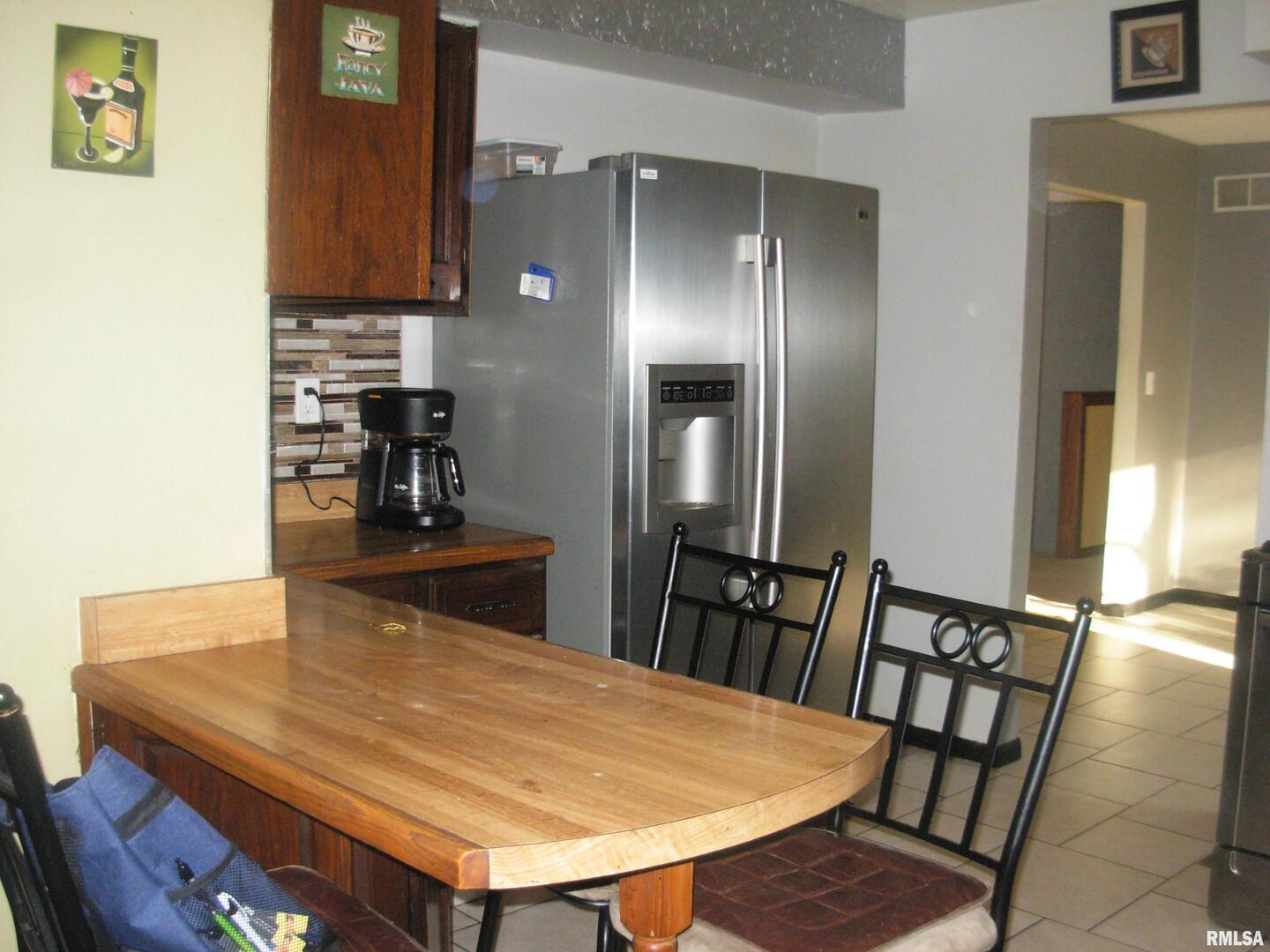 108 Andrea Court Cleveland, IL 61241 - Photo 17 of 32 a view of a dining room with furniture