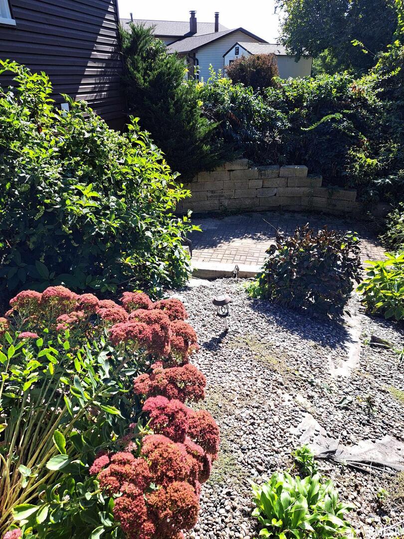 108 Andrea Court Cleveland, IL 61241 - Photo 31 of 32 a view of a garden with flowers