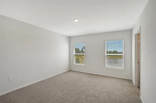 a view of empty room with windows
