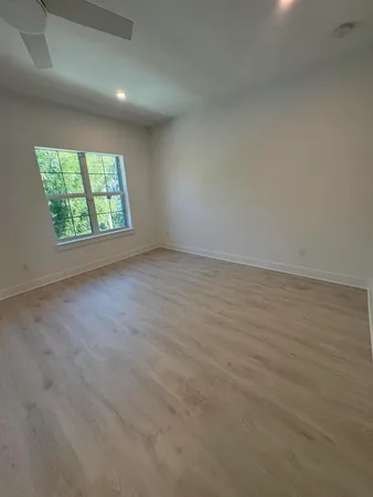 a bathroom with a shower and toilet