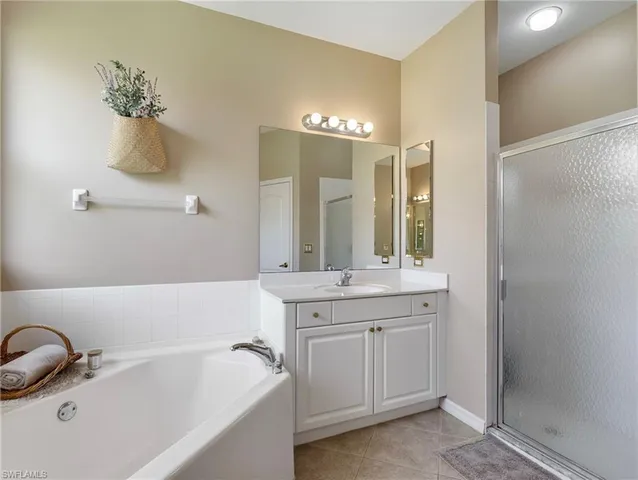a bathroom with a bathtub and a sink