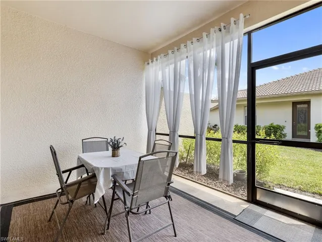 a view of a room with a large window