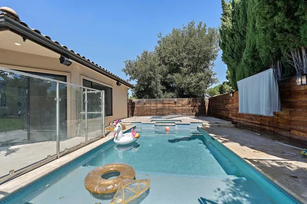 a view of a backyard with a tub