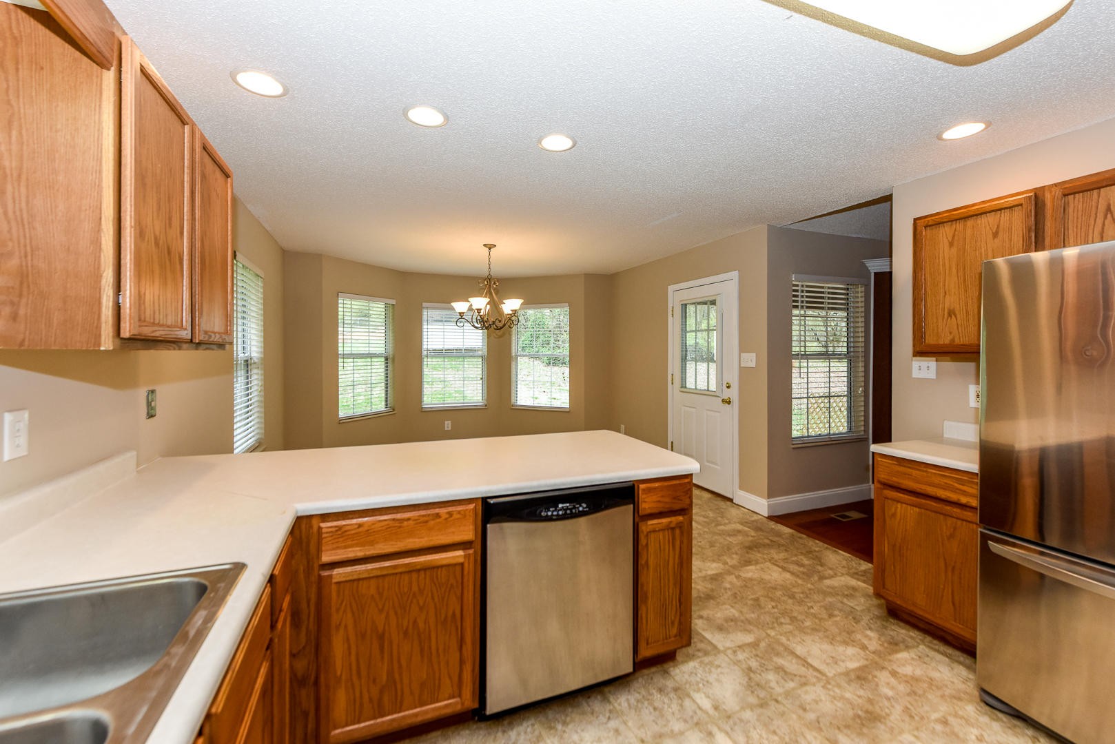 3605 Big Springs Ridge Road Friendsville, TN 37737 - Photo 12 of 32 a kitchen with stainless steel appliances granite countertop a refrigerator a sink and a stove