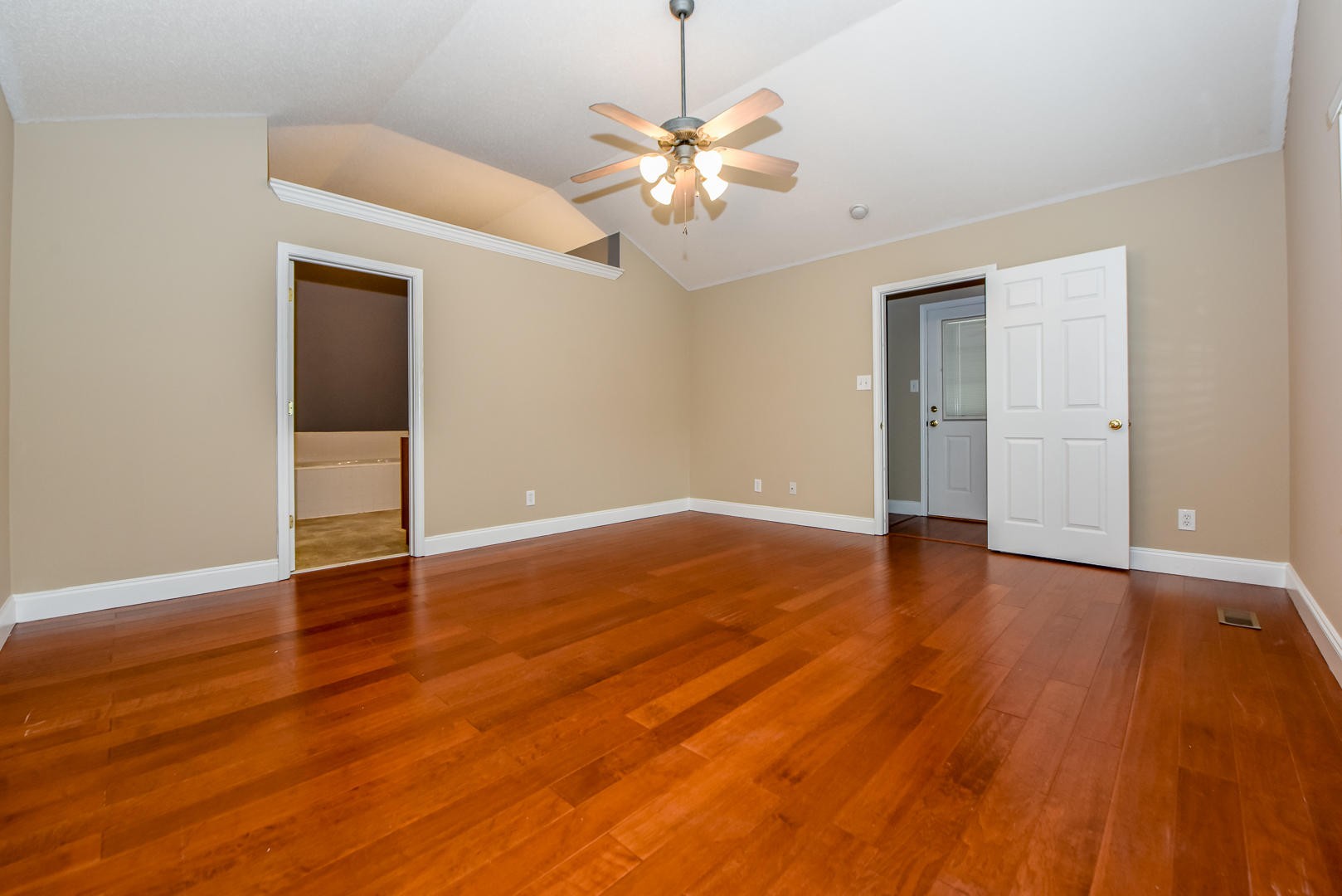3605 Big Springs Ridge Road Friendsville, TN 37737 - Photo 17 of 32 a view of a room with wooden floor and a ceiling fan