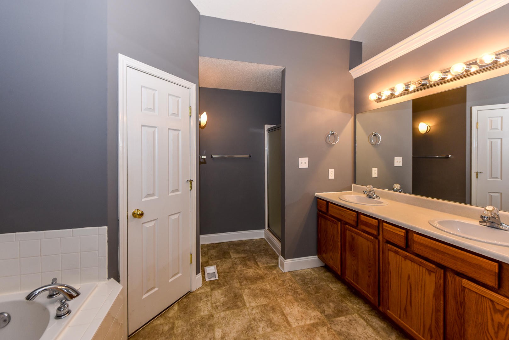 3605 Big Springs Ridge Road Friendsville, TN 37737 - Photo 18 of 32 a spacious bathroom with a mirror sink and shower