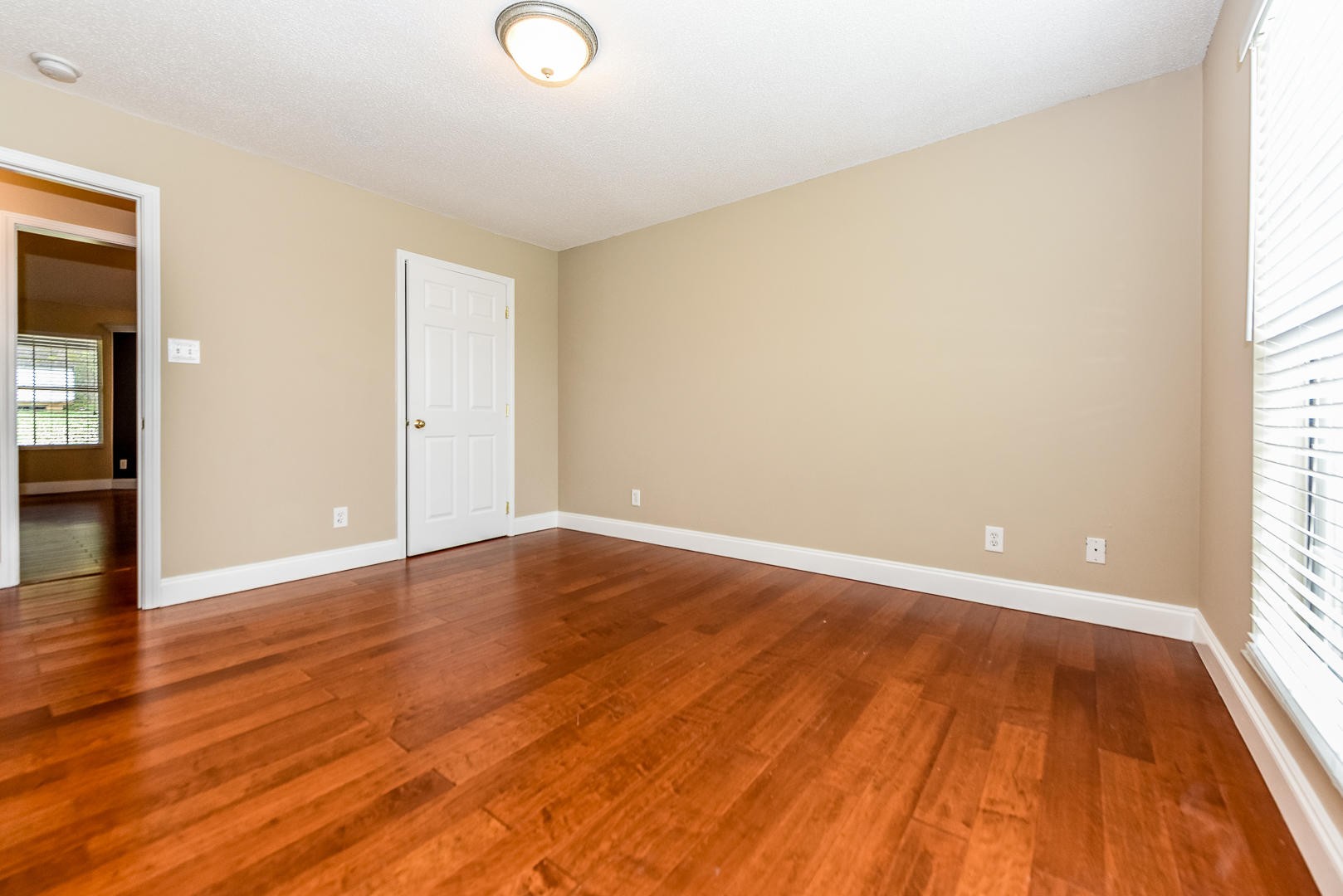 3605 Big Springs Ridge Road Friendsville, TN 37737 - Photo 25 of 32 a view of an empty room with wooden floor and a window