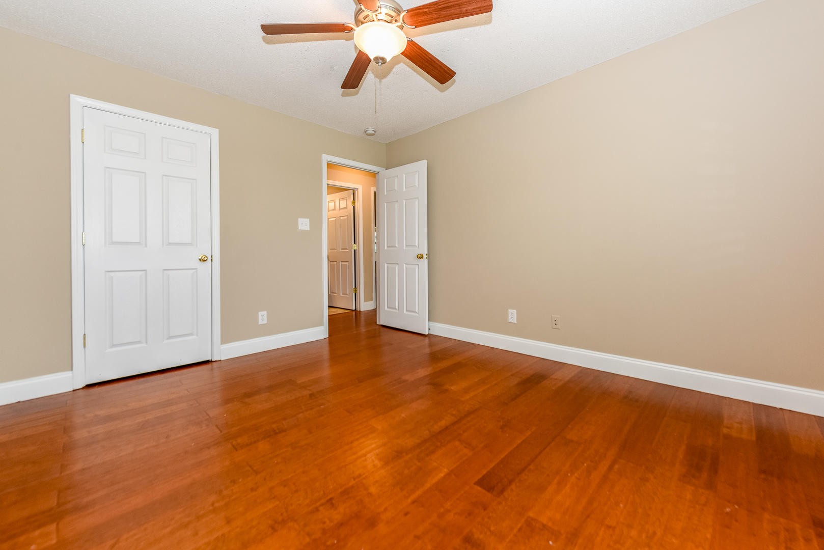 3605 Big Springs Ridge Road Friendsville, TN 37737 - Photo 27 of 32 an empty room with a window and a ceiling fan