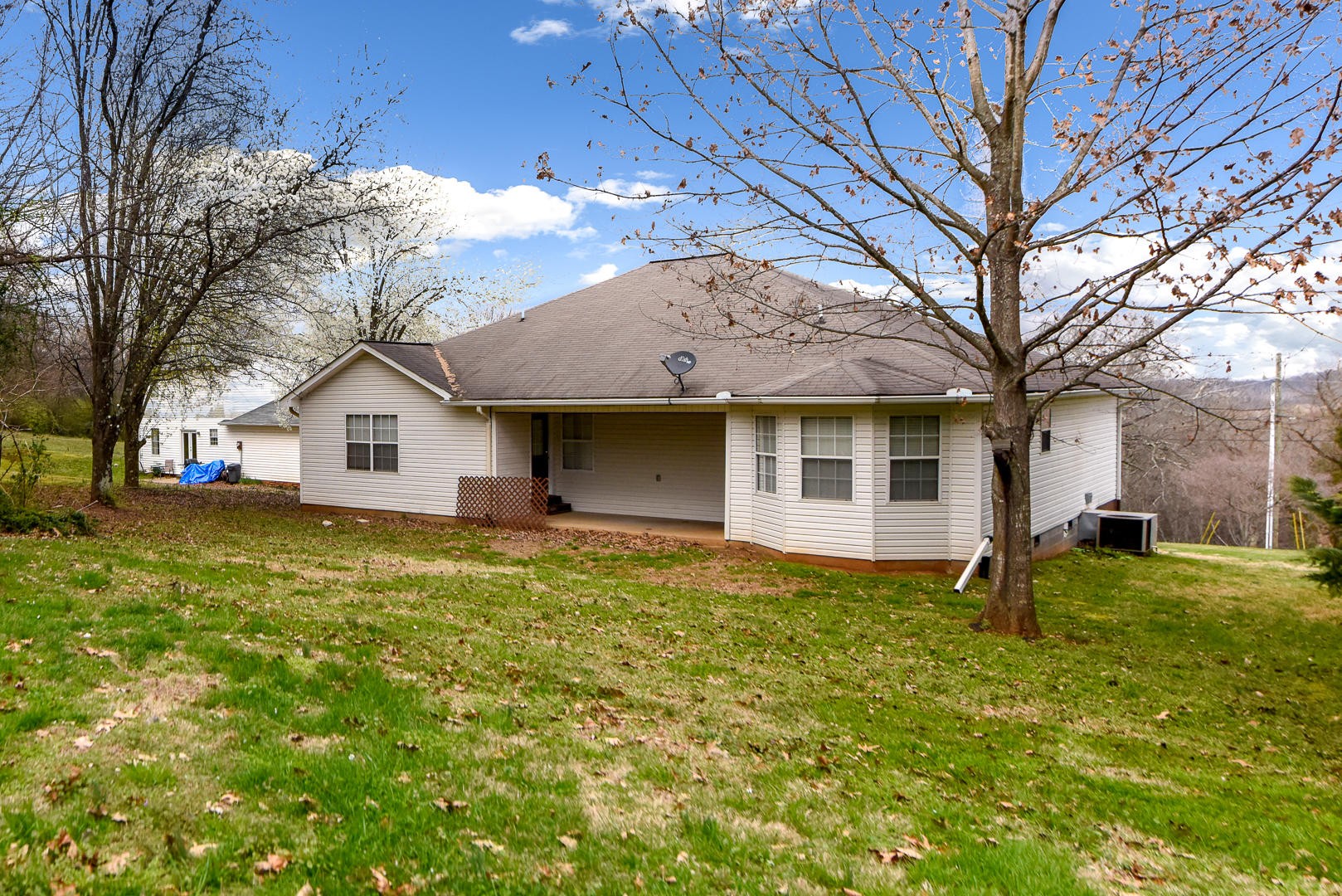 3605 Big Springs Ridge Road Friendsville, TN 37737 - Photo 31 of 32 a view of a house with a yard