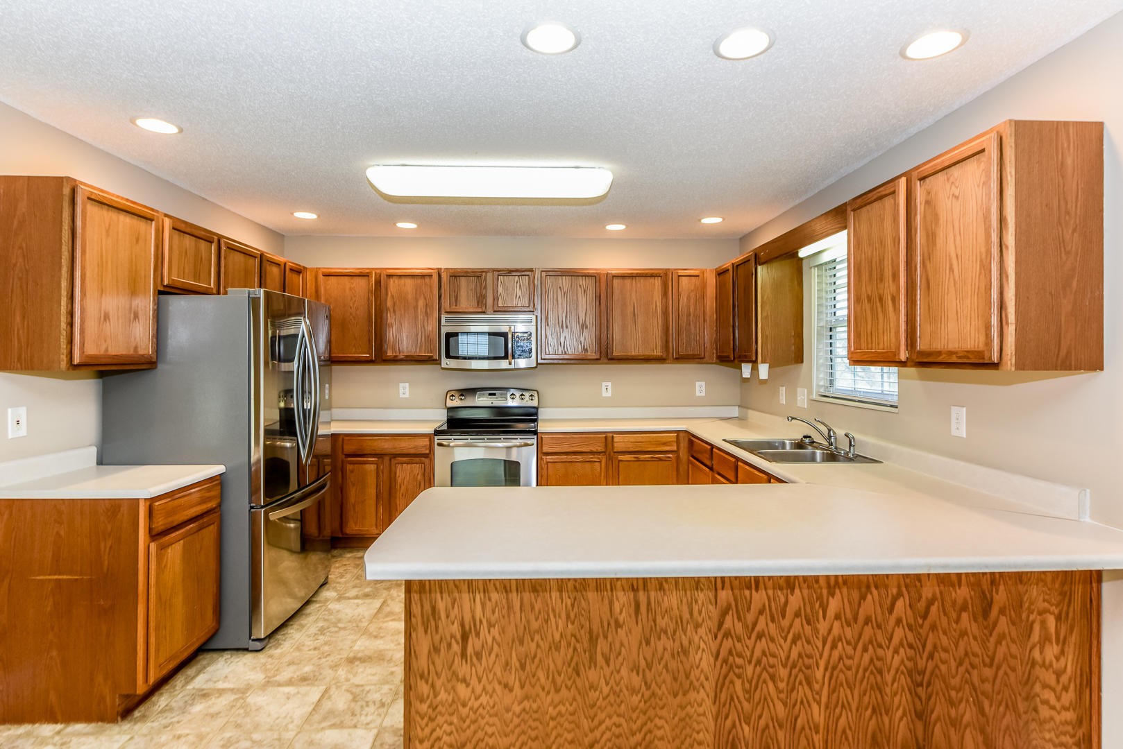 3605 Big Springs Ridge Road Friendsville, TN 37737 - Photo 7 of 32 a kitchen with stainless steel appliances granite countertop a sink refrigerator and cabinets