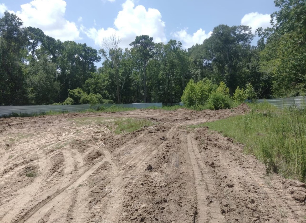 9612 Humble Westfield Road Houston, TX 77032 - Photo 7 of 9 a view of a dirt road with trees in the background