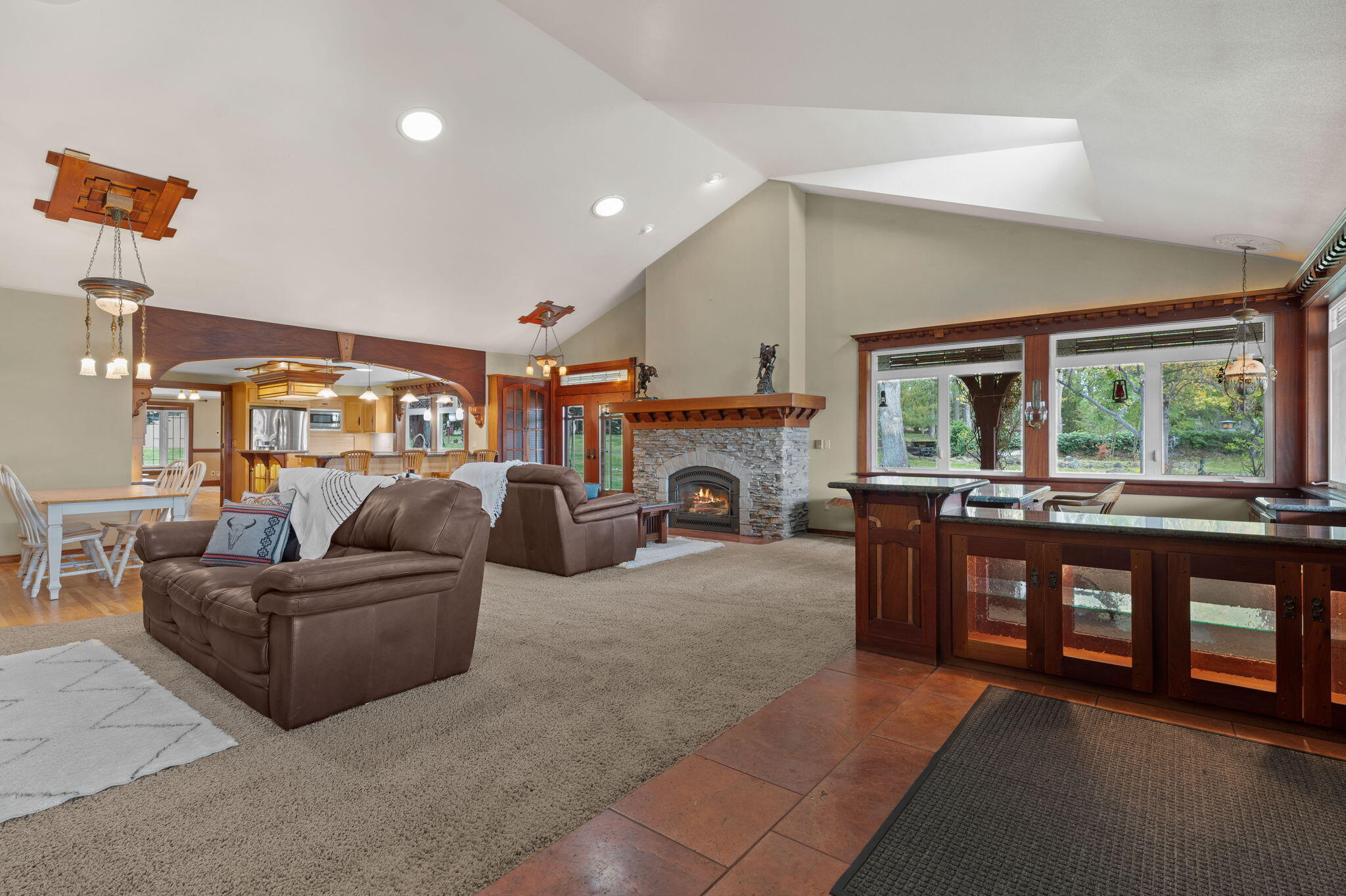 21925 Bear Creek Road Bend, OR 97702 - Photo 10 of 104 a living room with furniture and a fireplace