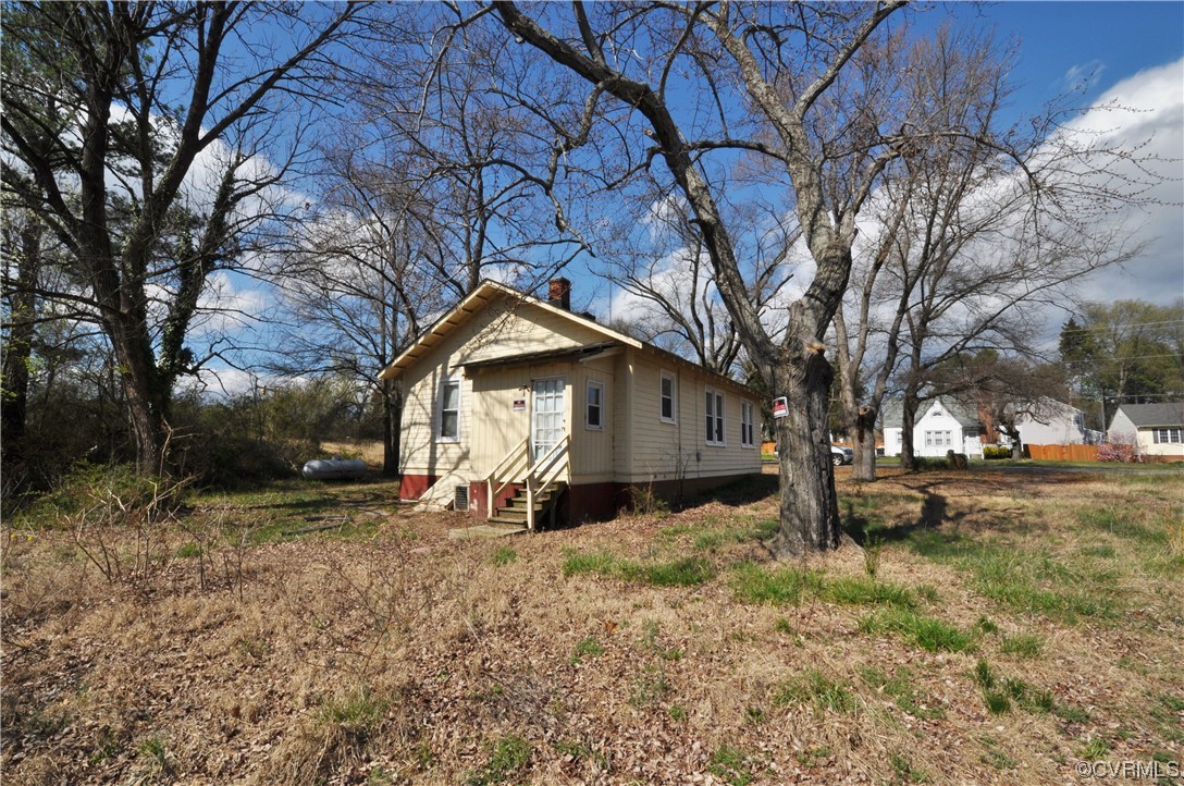 5301 Penick Road Richmond, VA 23228 - Photo 11 of 11 a dirt road with large trees and parked beside it