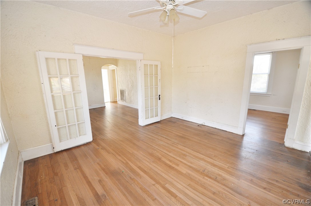 5301 Penick Road Richmond, VA 23228 - Photo 3 of 11 an empty room with wooden floor and windows