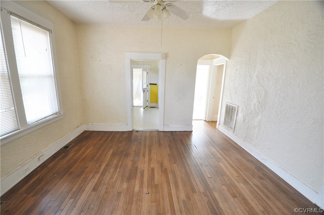 5301 Penick Road Richmond, VA 23228 - Photo 5 of 11 an empty room with wooden floor and a window