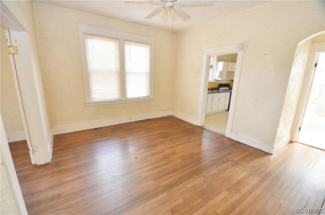 5301 Penick Road Richmond, VA 23228 - Photo 9 of 11 an empty room with wooden floor and windows