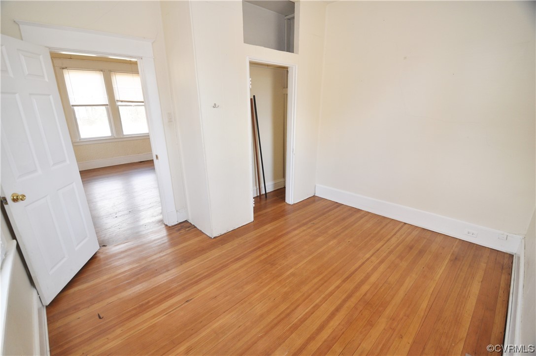 5301 Penick Road Richmond, VA 23228 - Photo 10 of 11 an empty room with wooden floor and windows