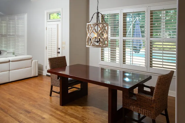 a view of a livingroom with furniture and a window