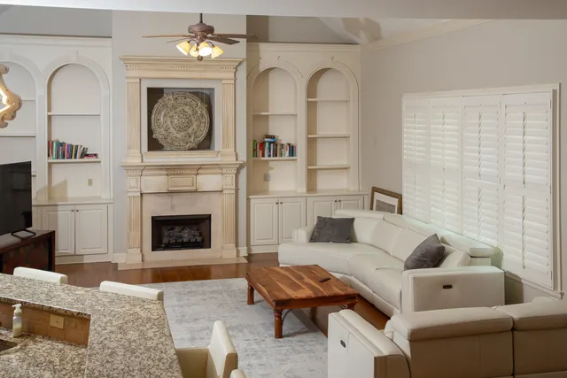 a living room with furniture and a fireplace