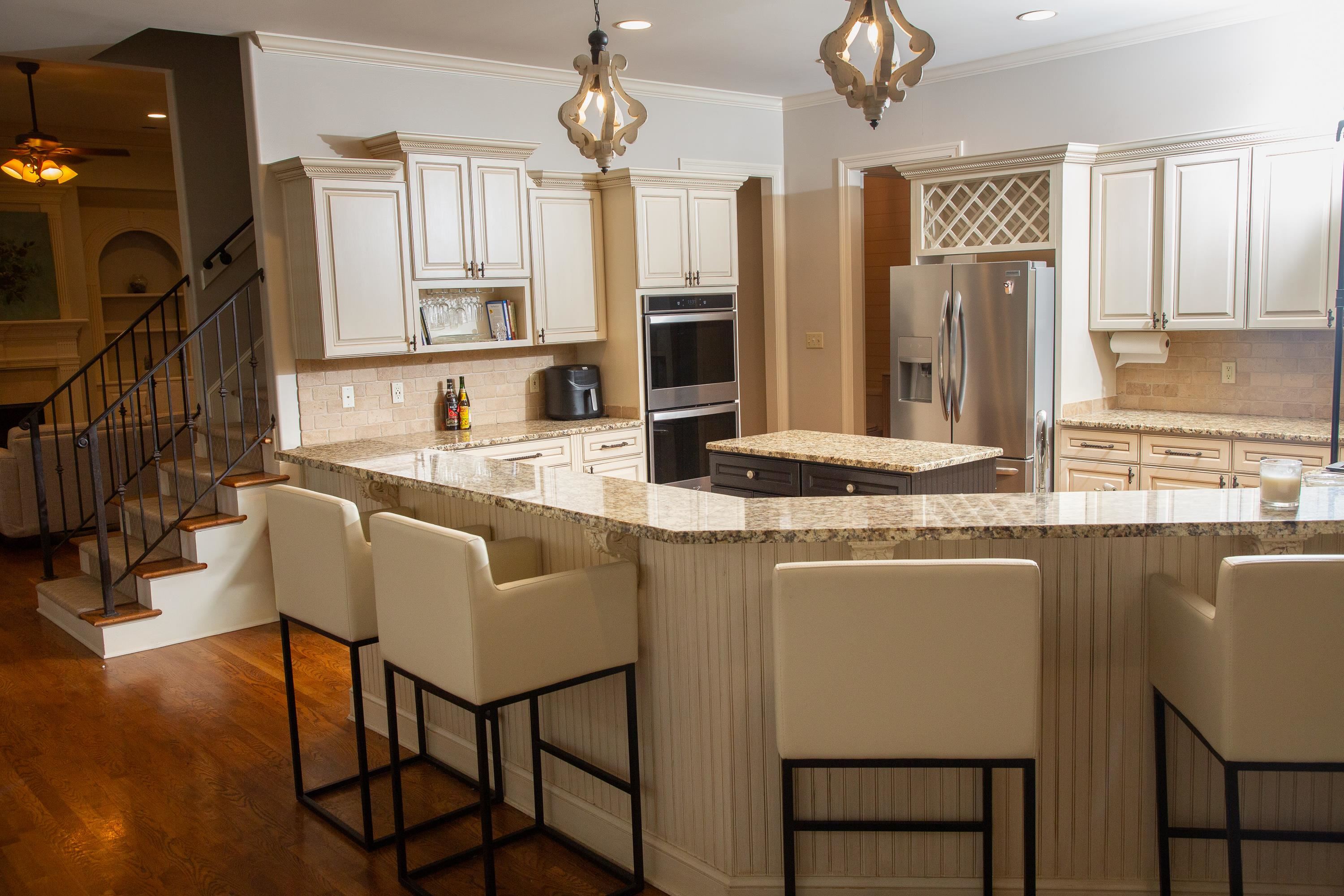 10060 Avent Ridge Cove Collierville, TN 38017 - Photo 20 of 40 a dining table with chairs and chandelier