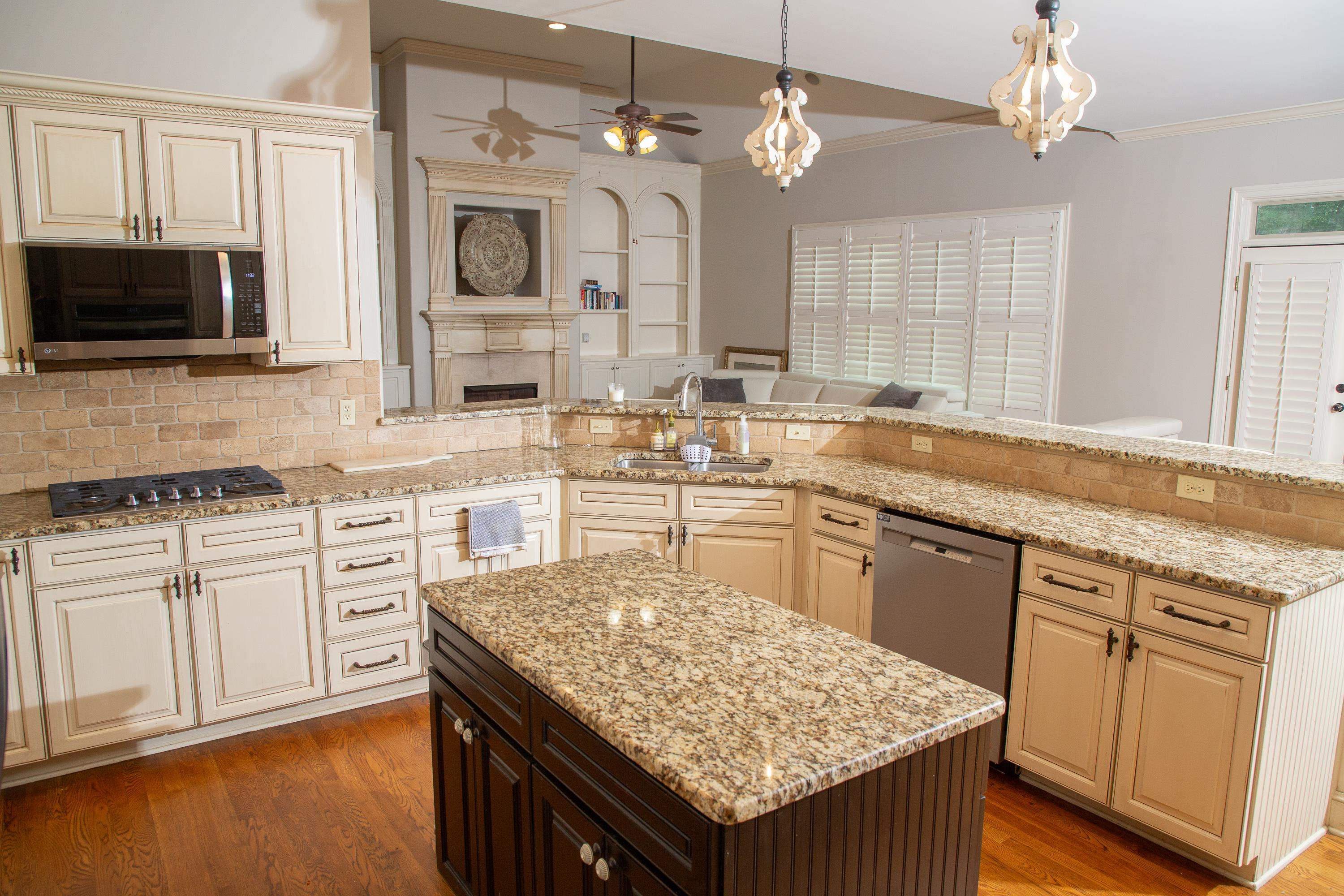 10060 Avent Ridge Cove Collierville, TN 38017 - Photo 21 of 40 a kitchen with stainless steel appliances granite countertop a sink stove and microwave