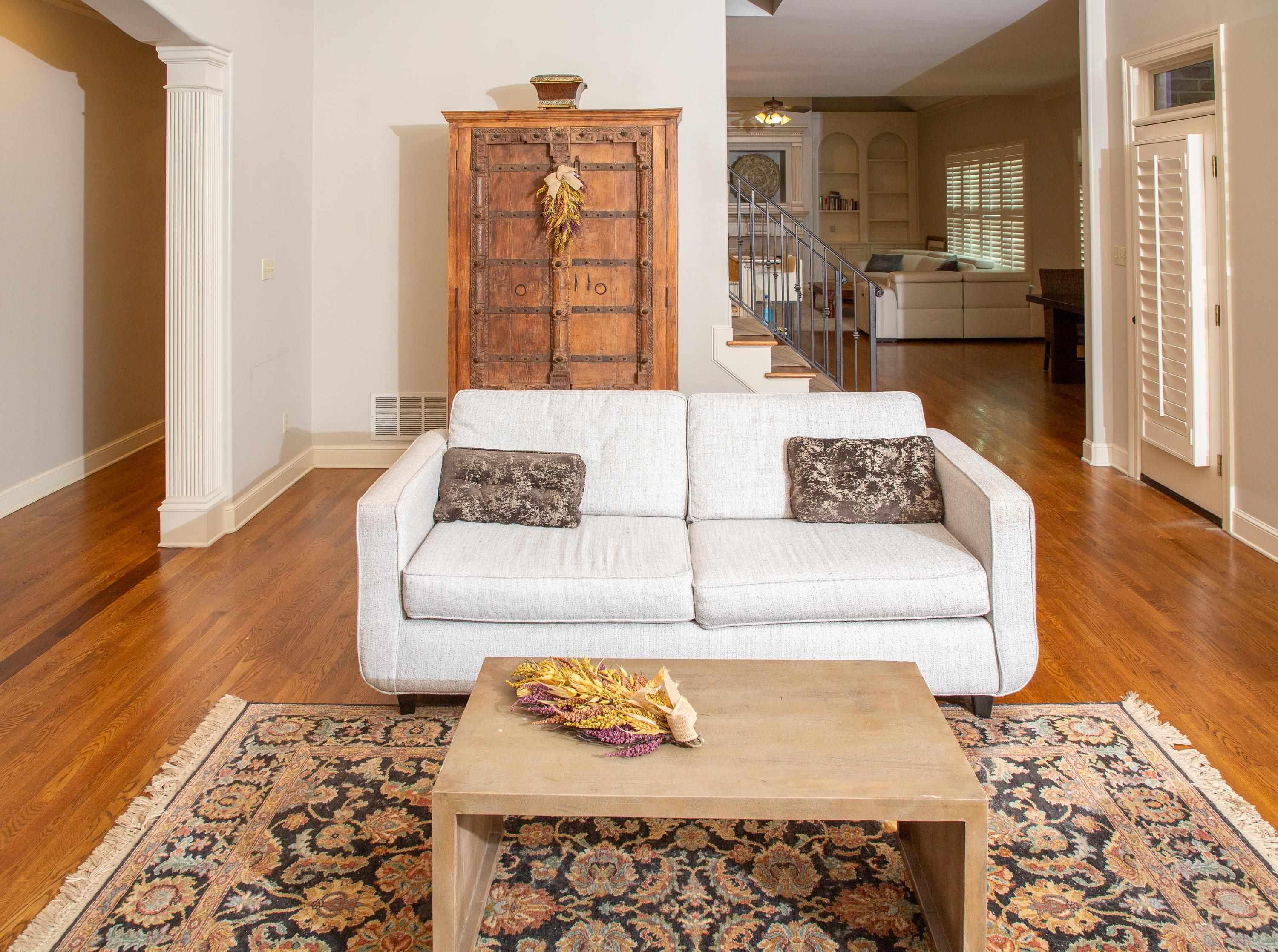 10060 Avent Ridge Cove Collierville, TN 38017 - Photo 25 of 40 a living room with furniture and a rug