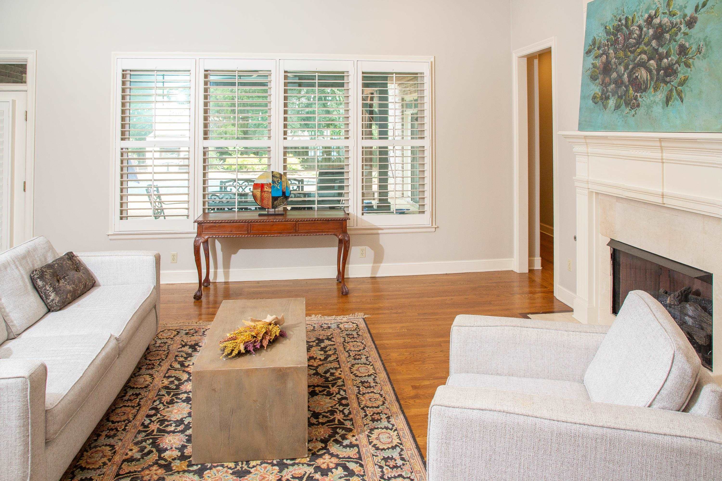 10060 Avent Ridge Cove Collierville, TN 38017 - Photo 26 of 40 a living room with furniture and a fireplace