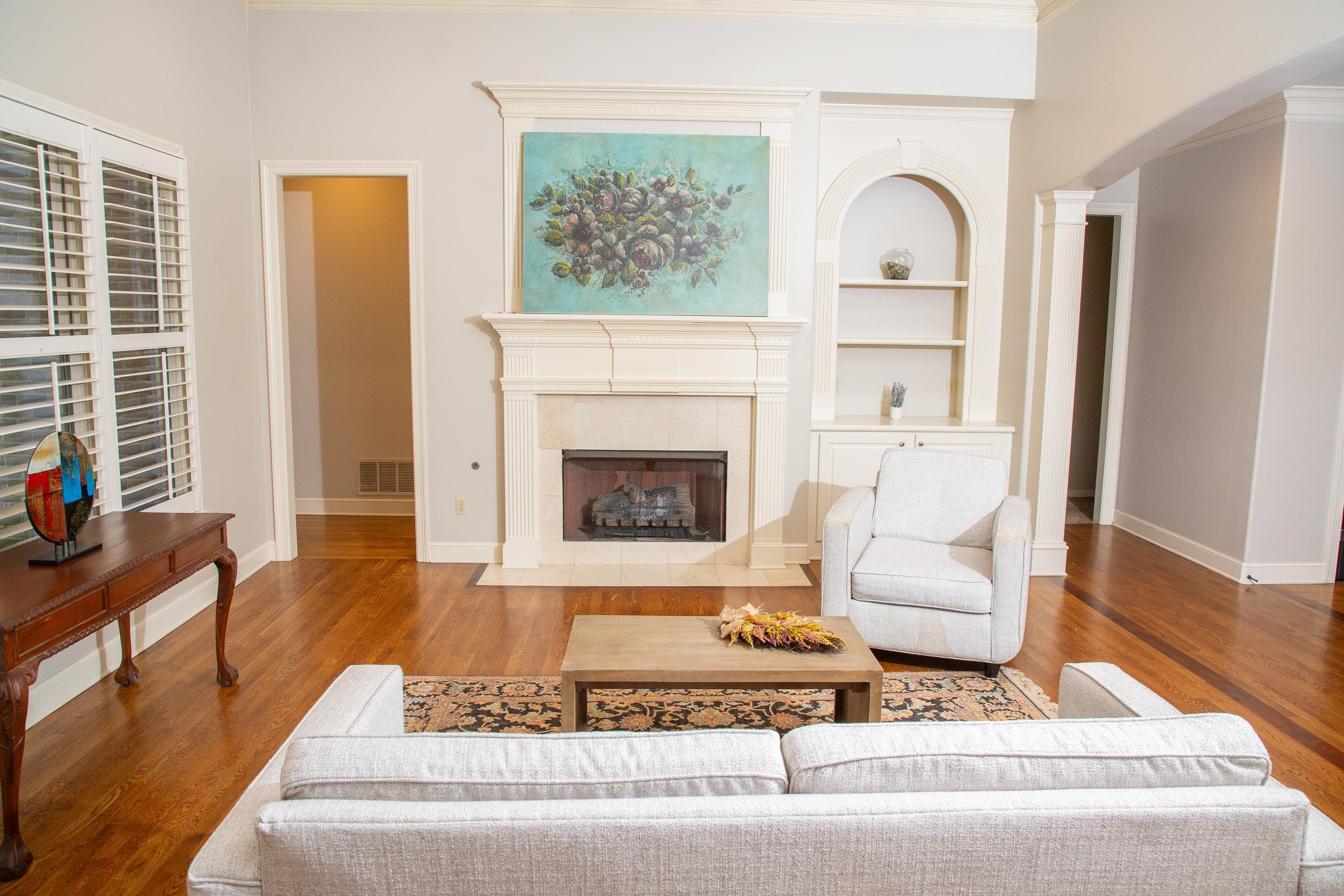 10060 Avent Ridge Cove Collierville, TN 38017 - Photo 27 of 40 a living room with furniture and a fireplace