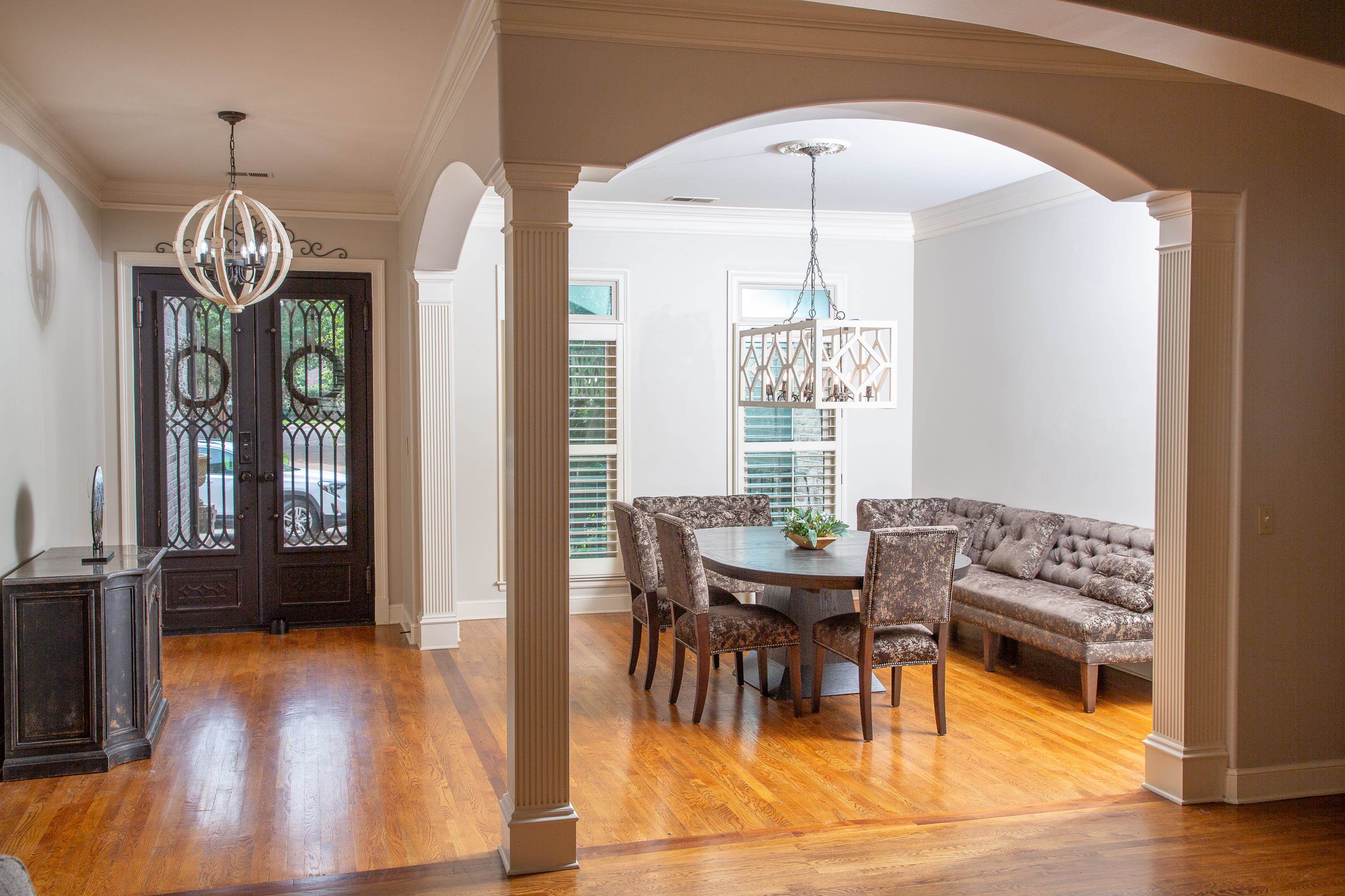 10060 Avent Ridge Cove Collierville, TN 38017 - Photo 3 of 40 a view of a dining room with furniture window and wooden floor