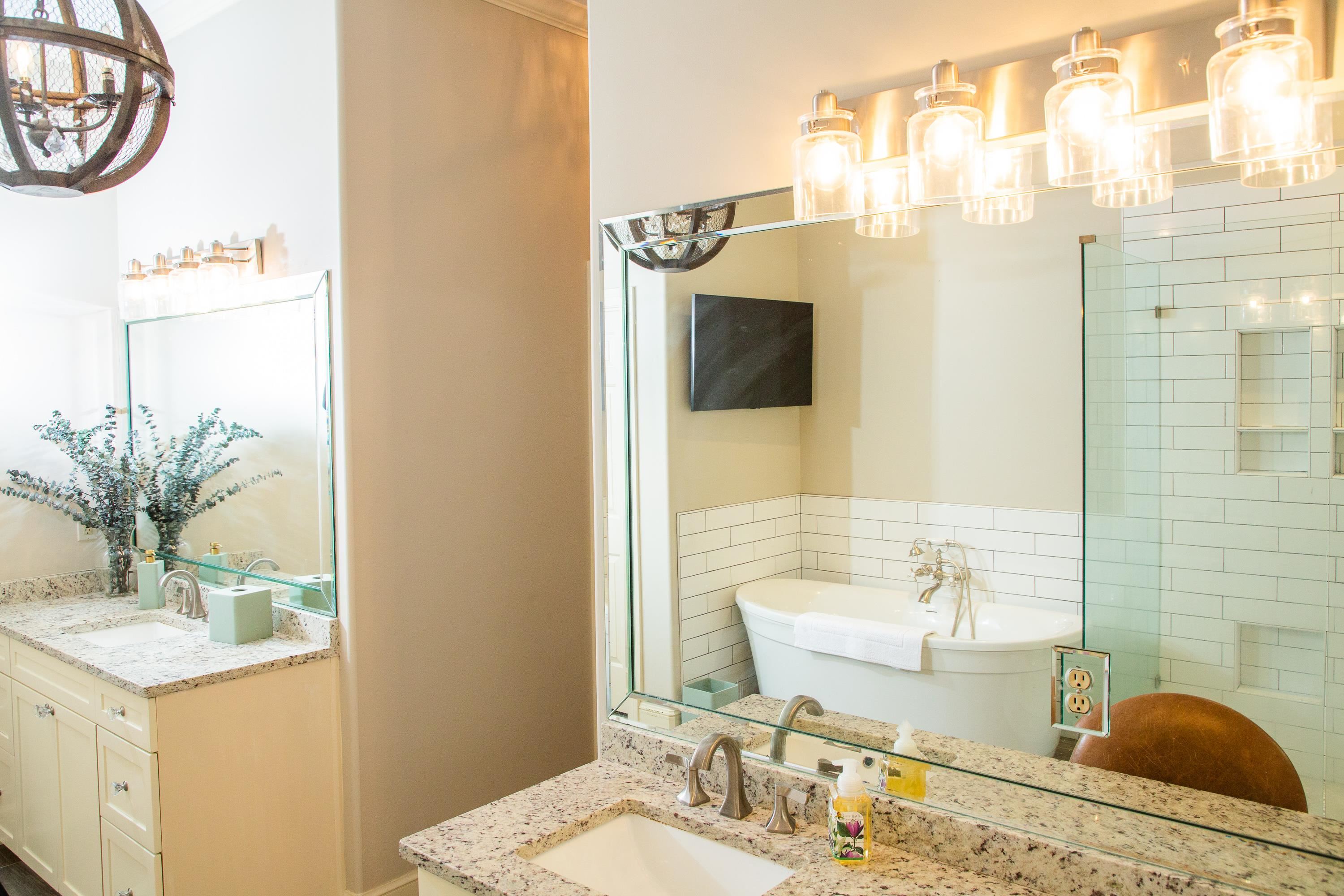 10060 Avent Ridge Cove Collierville, TN 38017 - Photo 37 of 40 a bathroom with a sink and a mirror