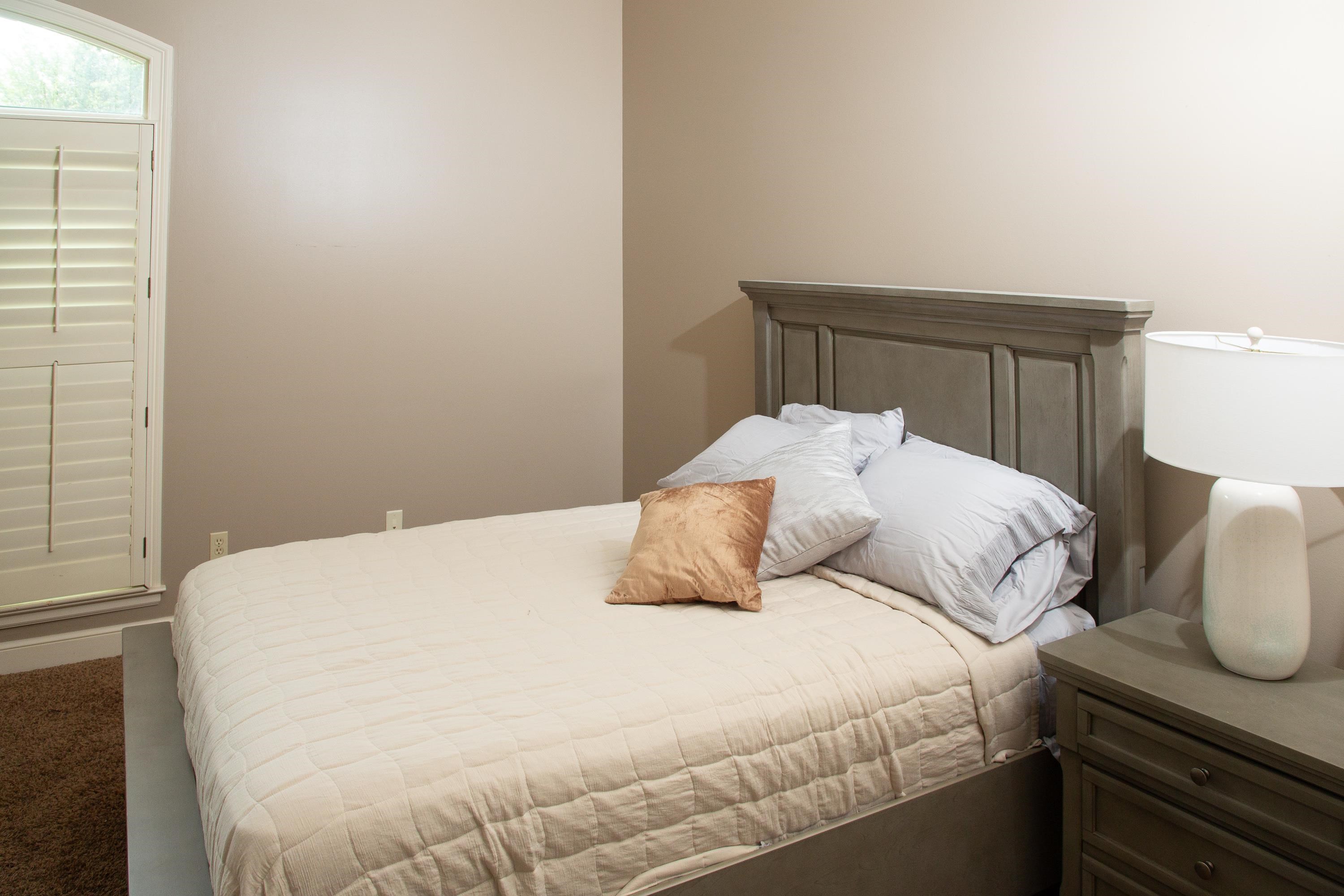 10060 Avent Ridge Cove Collierville, TN 38017 - Photo 9 of 40 a bedroom with a bed and wooden floor