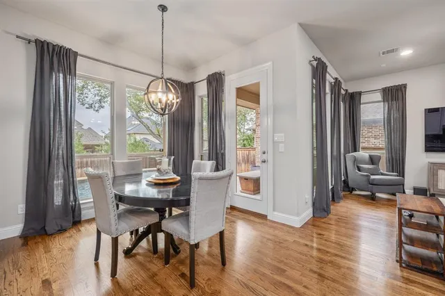 a dining room with furniture window wooden floor