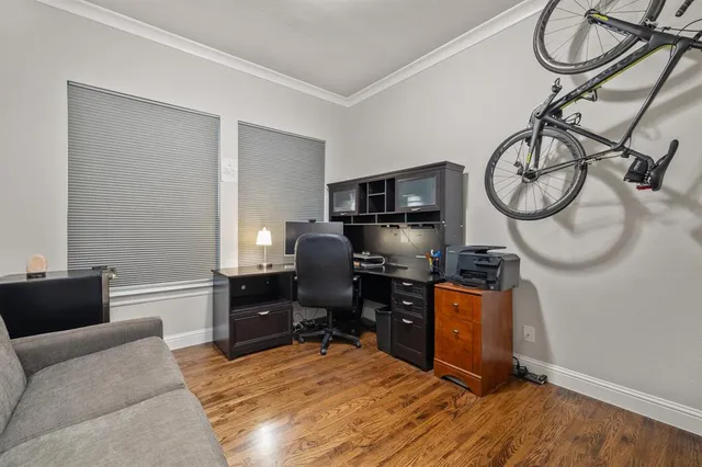 a bedroom with furniture and a air conditioner vent