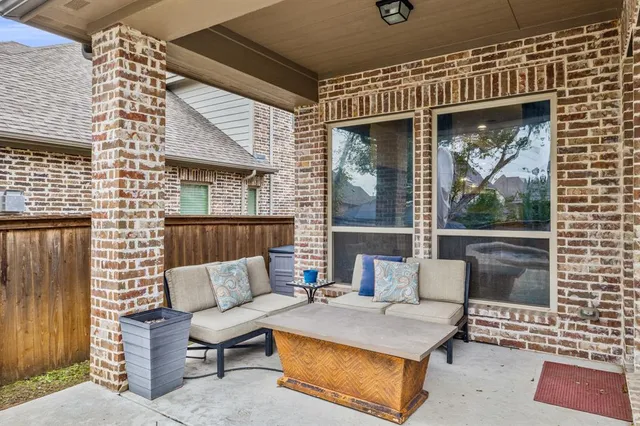 a outdoor living space with patio furniture and a wooden floor