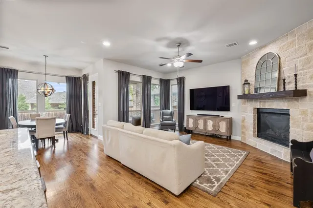 a living room with furniture fireplace and flat screen tv