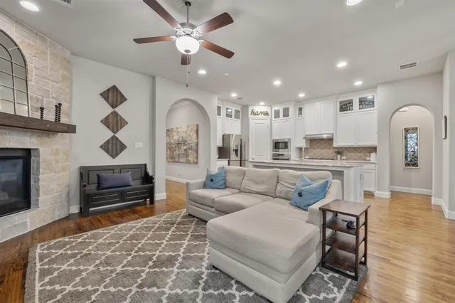 a living room with furniture and a fireplace