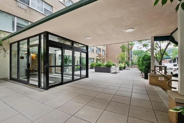 a picture of a bench in a white wall
