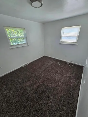 a view of a room that has a window in it