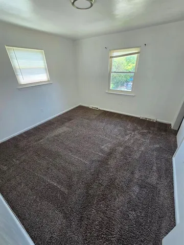 a view of a room that has a window in it