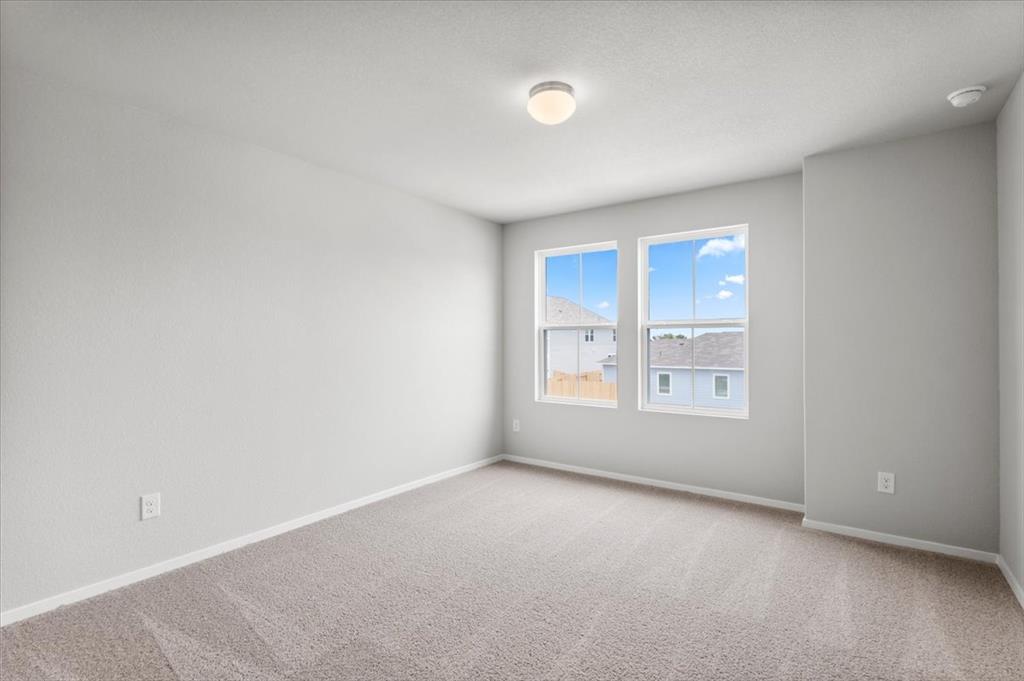 2707 Totley Road Manor, TX 78653 - Photo 24 of 39 Spare room featuring carpet floors and a smoke detector