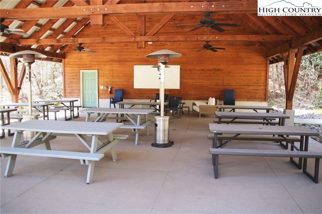 247 Hawkbill Road Ferguson, NC 28624 - Photo 20 of 25 a view of a patio with a table and chairs