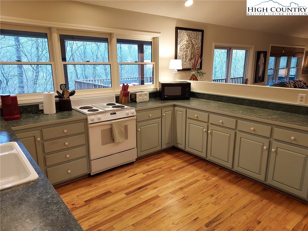 247 Hawkbill Road Ferguson, NC 28624 - Photo 2 of 25 a kitchen with sink and window